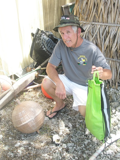 Paul Maley with a metallic sphere that is actually a float. Found in Tarawa, Republic of Kiribati May 11, 2013.